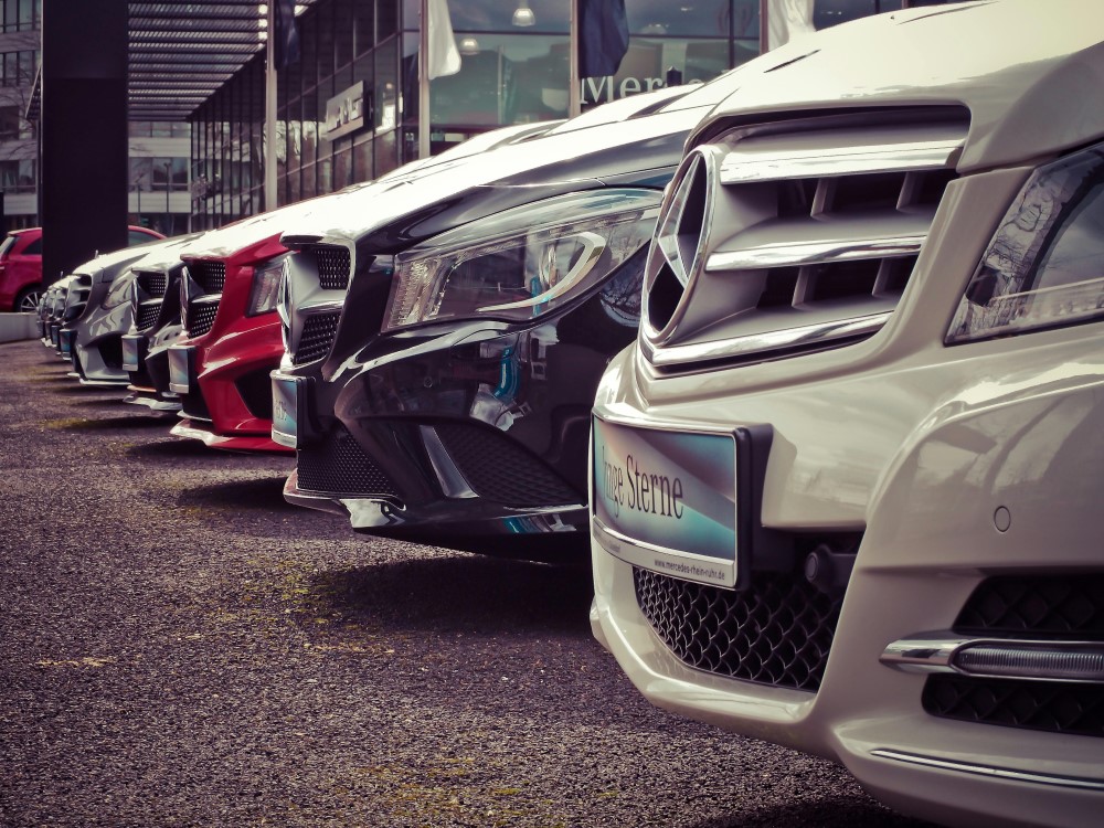 Different cars lined up in a lot