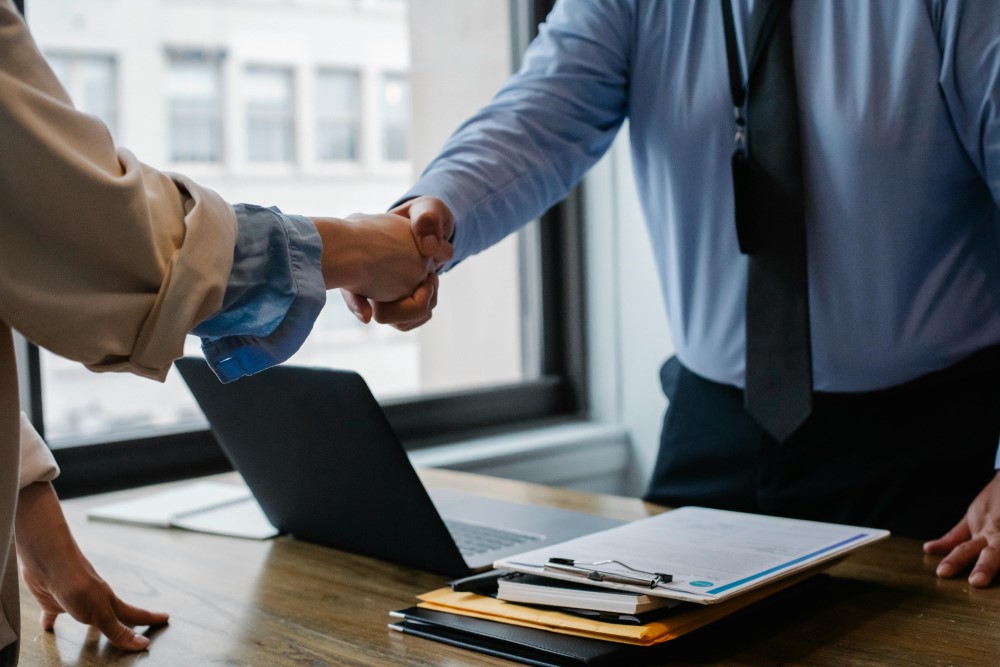 Business professionals connecting through a sales meeting.